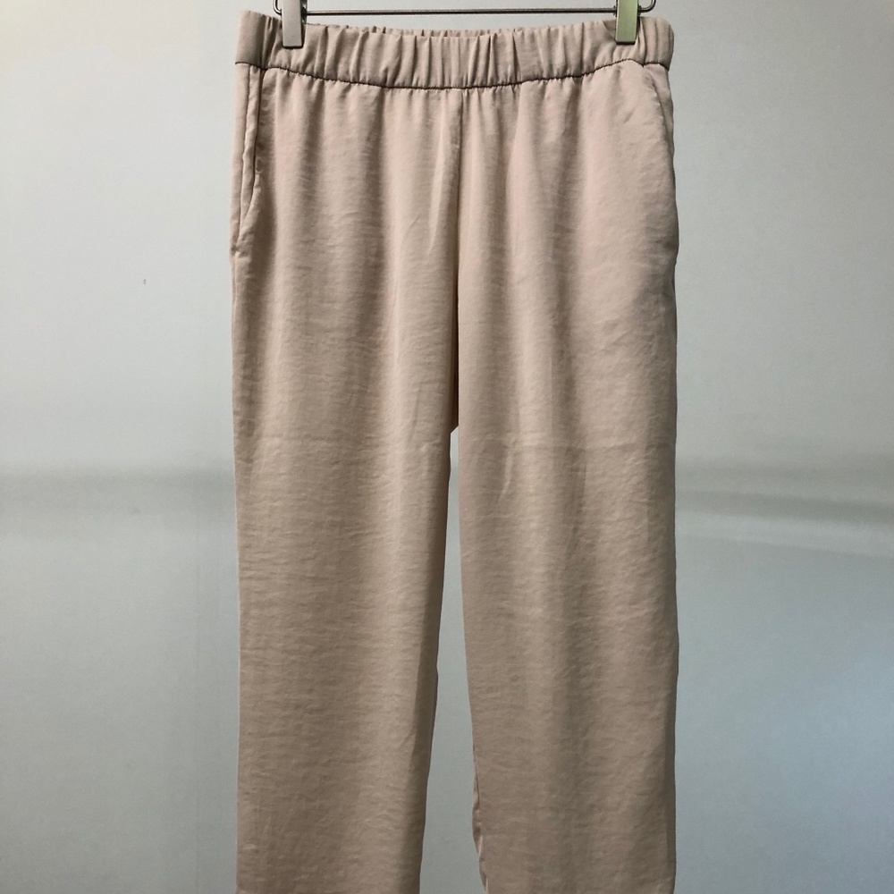 Blush-colored silky pants